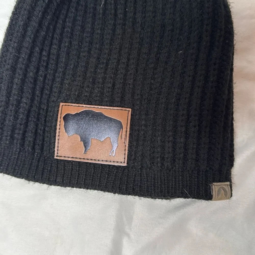 Buffalo Black Knit Pom-Pom Beanie with Brown Patch. One size.
